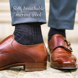 charcoal grey merino wool men's dress socks with light grey slacks and brown monkstraps